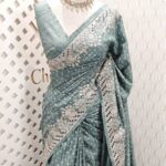 Semi tussar with peacock feather like work and cut work on border