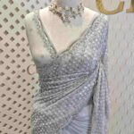 Georgette with random sequence and cut bead flower pattern and scallop border