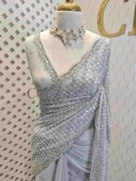 Georgette with random sequence and cut bead flower pattern and scallop border
