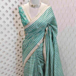 Jute silk with horizontal lines and thin golden border