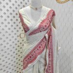 Jute silk with scallop like pattern on boarder