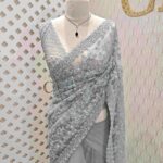 Net saree with beads, sequence snow flakes like design and scallop border
