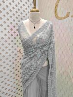 Net saree with beads, sequence snow flakes like design and scallop border
