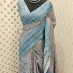 Semi tussar with ikat print and running embroidery design on border