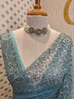 Net saree with sequence, stones small floral pattern and scallop border - Image 15