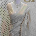 Organza with lotus flower applique like work and golden zari aari work