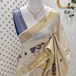 Kerala saree with daisy like flowers with yellow centers and copper stem design