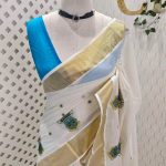 Kerala saree with kathakali thread embroidery design
