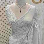 Organza with foil like embossed floral design and scallop border