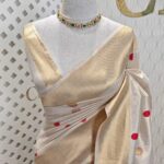 Kerala saree with polka dots and small diamond shape on border