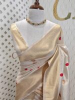 Kerala saree with polka dots and small diamond shape on border