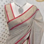 Linen with hand embroidered flower and leaves with fly stitches on boarder