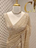 Net saree with diamond like jaal design and beaded zigzag pattern on border