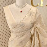 Organza with silver,golden zari floral and wavy lines pattern