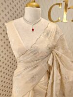 Organza with silver,golden zari floral and wavy lines pattern