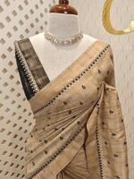 Semi tussar with check pattern and small triangle shapes on border