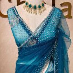 Net saree with cutbead floral design and sequence work on border