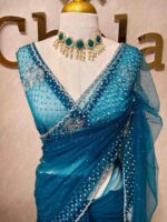Net saree with cutbead floral design and sequence work on border