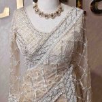 Net saree with sugar beads, tube beads diamond pattern and stitched blouse