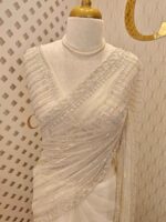 Net saree with cutbead and sequence work on horizontal direction - Image 34