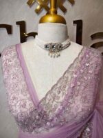 Net saree with intricate floral embroidery along the border - Image 5