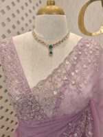 Net saree with intricate floral embroidery along the border - Image 14