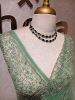 Net saree with intricate floral embroidery along the border - Image 9