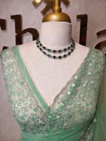 Net saree with intricate floral embroidery along the border - Image 8