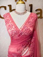 Net saree with intricate floral and vine embroidery along the border