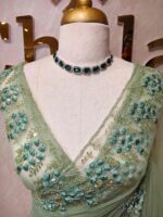 Net saree with intricate floral and vine embroidery along the border - Image 17