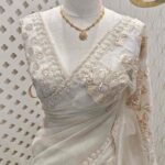 Organza with Turkish floral applique, sequence, cut beads work and shadow work on border
