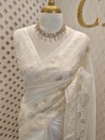 Organza with small floral, leafy applique work and diamond shaped thread work border