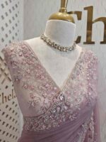 Net saree with intricate floral embroidery along the border - Image 18