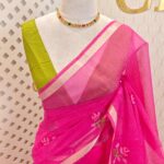 Net kota with cross stitch floral motif and golden border