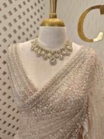 Net saree with sequence and zigzag cut bead border - Image 11