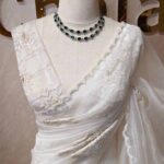 organza with turkish big flowers on pallu like aslant and heavy work on body