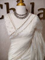 Organza with turkish large flower on pallu potion and hilighted on sequence work