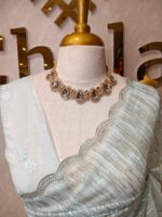 Organza with vertical metallic looking thread and decorative scallop boarder - Image 4