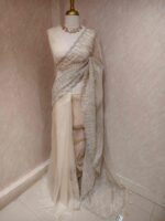 Organza with vertical metallic looking thread and decorative scallop boarder - Image 9