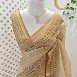 Linen with detailed embroidery works notably french knots on the pallu and the boarder