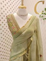 Linen saree with a border is adorned with detailed floral embroidery, possibly using French knots, and features sequins and a decorative woven edge - Image 4