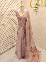 Linen saree with a border is adorned with detailed floral embroidery, possibly using French knots, and features sequins and a decorative woven edge - Image 3