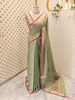 Linen saree with intricate floral motifs in shades of red, yellow, and beige, accompanied by green leaves and decorative horizontal running stitches - Image 2