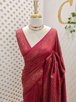 Soft katan with the main body of the saree has an all over floral motif and the boarder has diamond shaped patterns