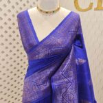 Tussar banarasi with triangle shaped buttas and zigzag pattern on border