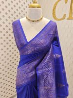Tussar banarasi with triangle shaped buttas and zigzag pattern on border