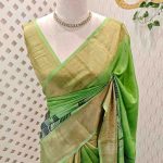 Tussar silk with green, blue flowing lines highlighted with golden metalic thread work