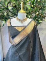 Kanjeevaram saree with a check pattern across the main body and complemented by a rich border and pallu - Image 10