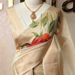 Kerala saree with prints of large blossom like prints on the pallu and body