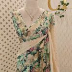 Kerala saree with simple body and multi coloured thick floral prints